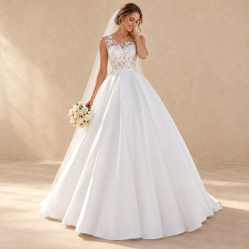 Robe de mariée longue blanche en dentelle, vue de face, ambiance beige