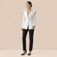 Blazer long cintré à épaules structurées et ouvertures aux épaules