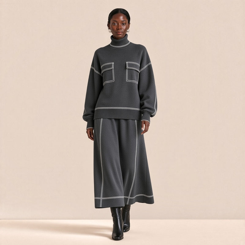 Ensemble en maille pull col roulé et jupe trapèze midi SAKIWE gris foncé, mannequin marchant vers l’objectif