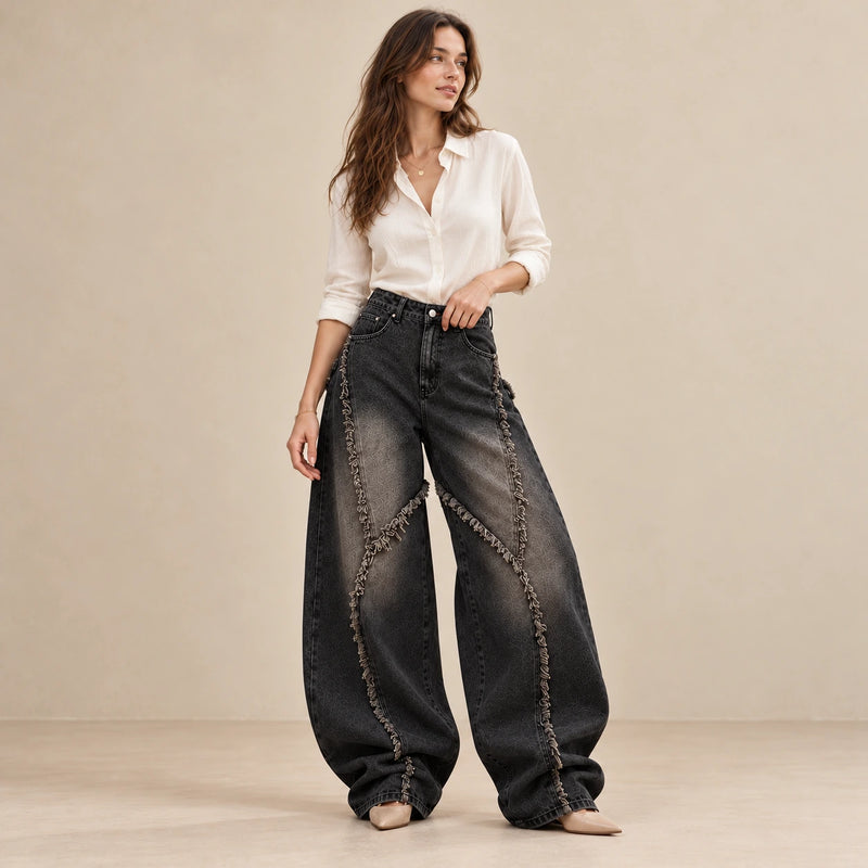 Jean baggy noir-gris vintage à coutures courbes effilochées, vue trois-quarts et taille