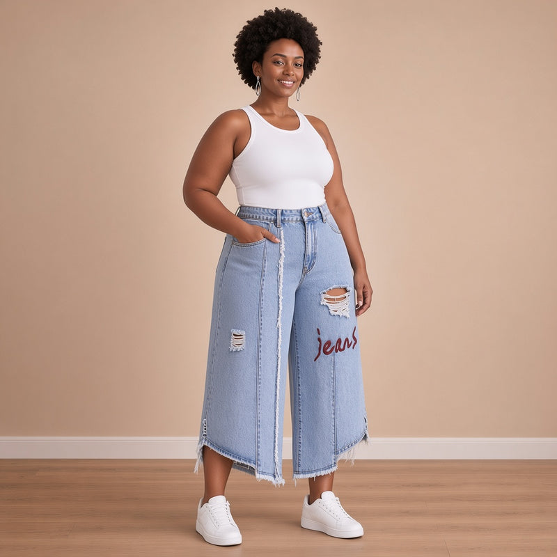 Jean capri à déchirures et inscription, vue de trois quarts