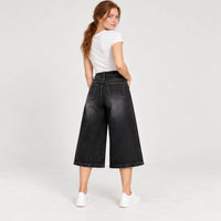 Jean corsaire noir taille haute et jambes larges, vue arrière portée en studio