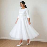Robe de mariée mi-longue en tulle à manches trois-quarts, blanc, en mouvement – SAKIWÉ