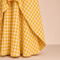 Robe longue en vichy sans manches à surjupe SAKIWE jaune, gros plan surjupe à pointes et ourlet
