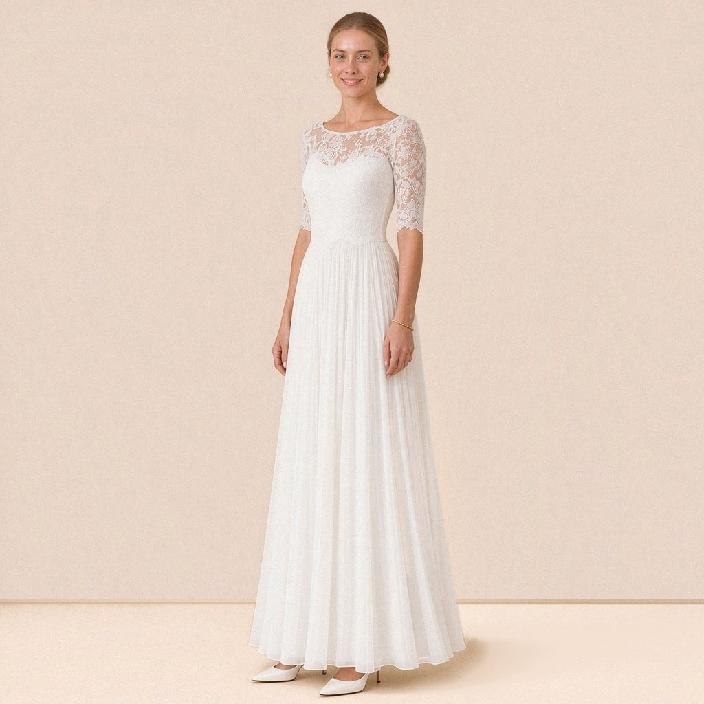 Robe de mariée en dentelle à manches au coude et jupe longue plissée, vue de trois quarts