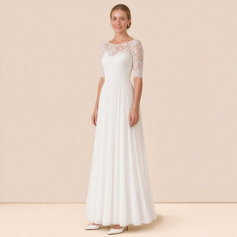 Robe de mariée en dentelle à manches au coude et jupe longue plissée, vue de trois quarts