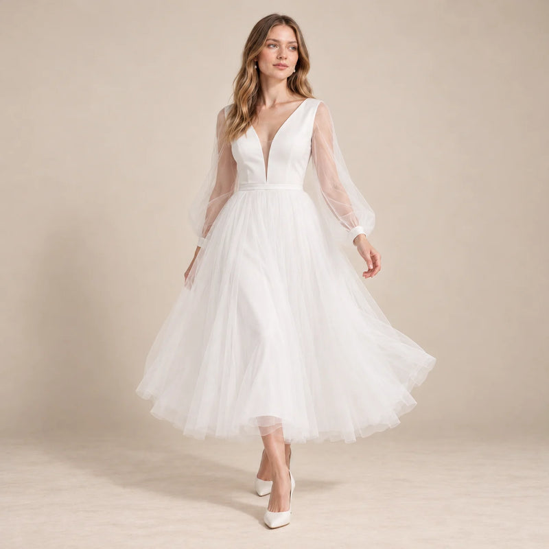 Robe de mariée midi blanche en mouvement, jupe évasée en tulle