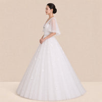 Robe de mariée princesse vue de profil, volume de la jupe en tulle