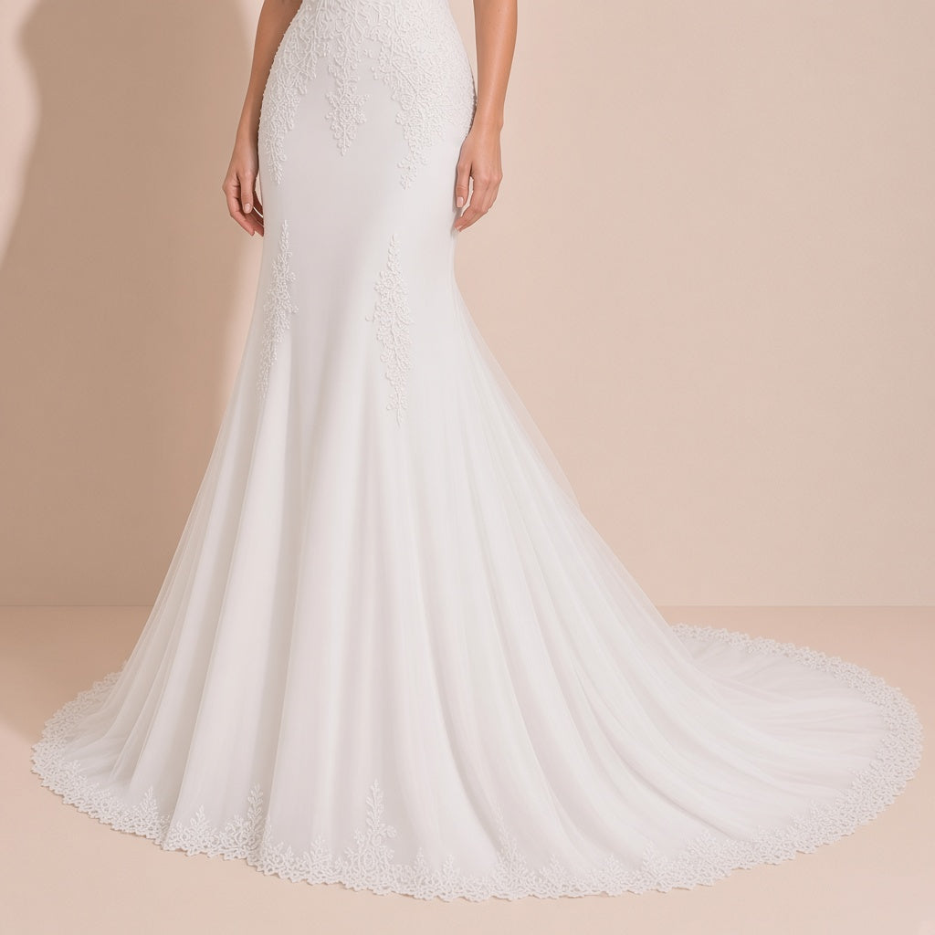 Robe de mariée portée, détail de la jupe en tulle et de la traîne bordée de dentelle festonnée